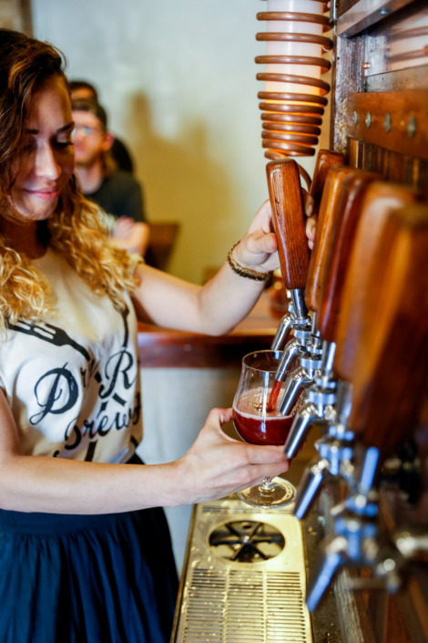 Woman pouring beer